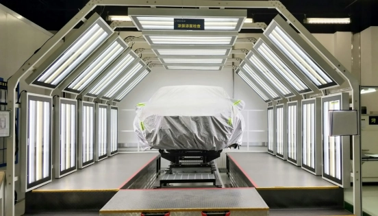 covered-vehicle-in-illuminated-automotive-bay